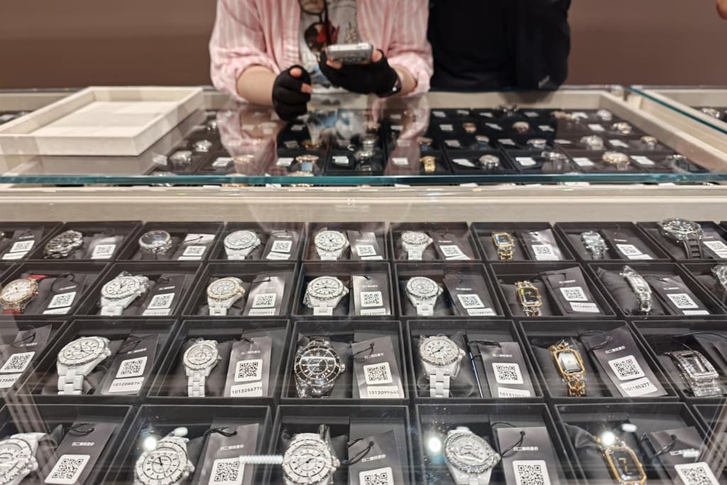 Watches displayed in a counter of secondhand luxury goods at the Zhuanzhuan superstore in the Jing'an District in Shanghai