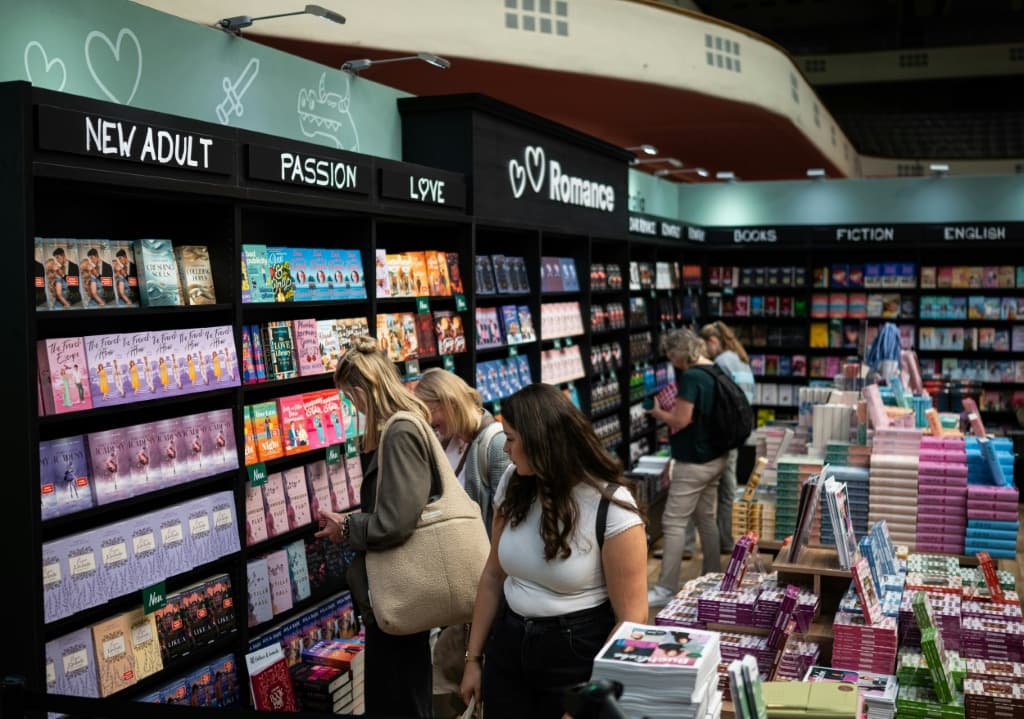 Visitors browse bookshelves at the Frankfurt Book Fair