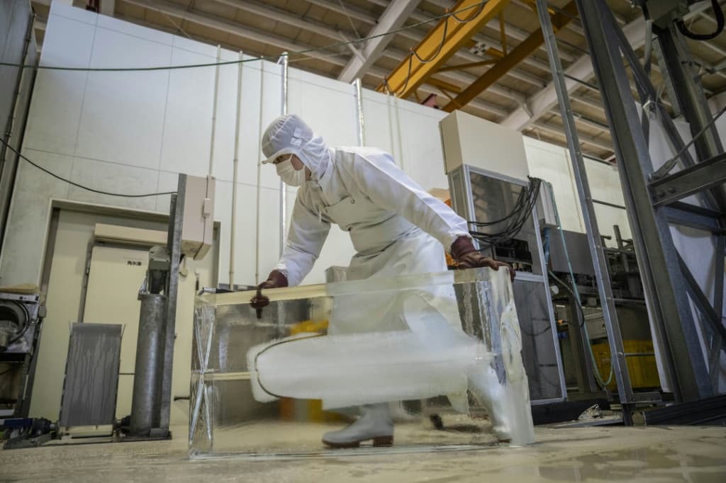 The men work for Kuramoto Ice, a century-old company in Ishikawa on the Sea of Japan coast and one of dozens of Japanese firms producing ultra-clear, premium ice