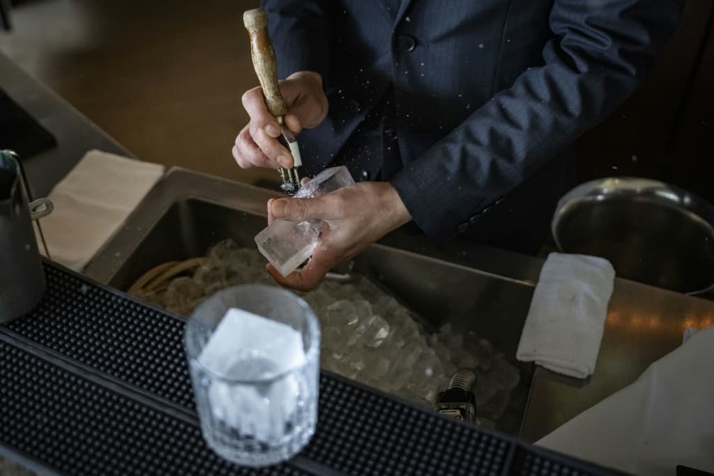 At a Hilton Hotel bar near Tokyo, bartender Shingo Miyachi prepares a negroni with one of Kuramoto Ice's big, clear cubes