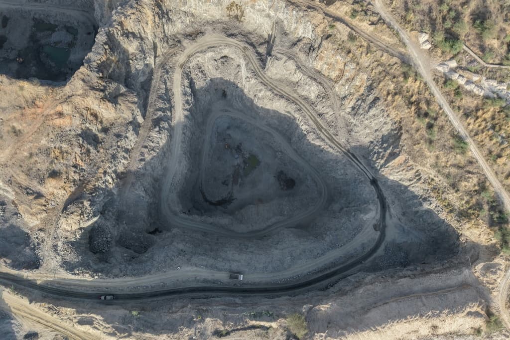 An open-cast stone quarry in the Aravalli mountain range in Rajasthan's Neem ka Thana town