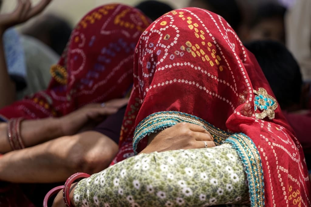 Veiled women protest against mining at Bhagwanpura village in Rajasthan's Neem ka Thana town