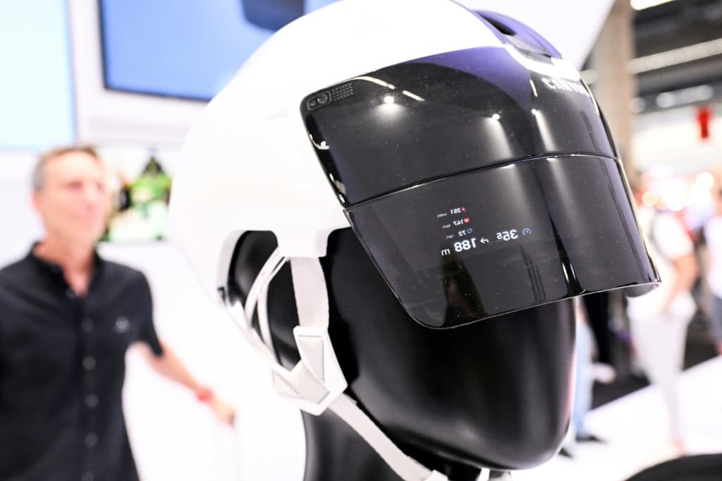 A helmet displays data on its visor at the booth of Canyon