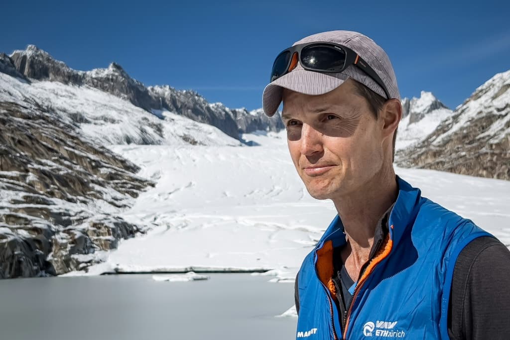 Glaciologist Matthias Huss standing next to the Rhone Glacier above Gletsch, in the Swiss Alps