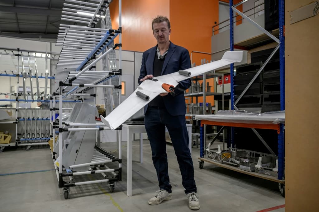 Co-founder of France's Delair, Bastian Mancini, shows off some hardware
