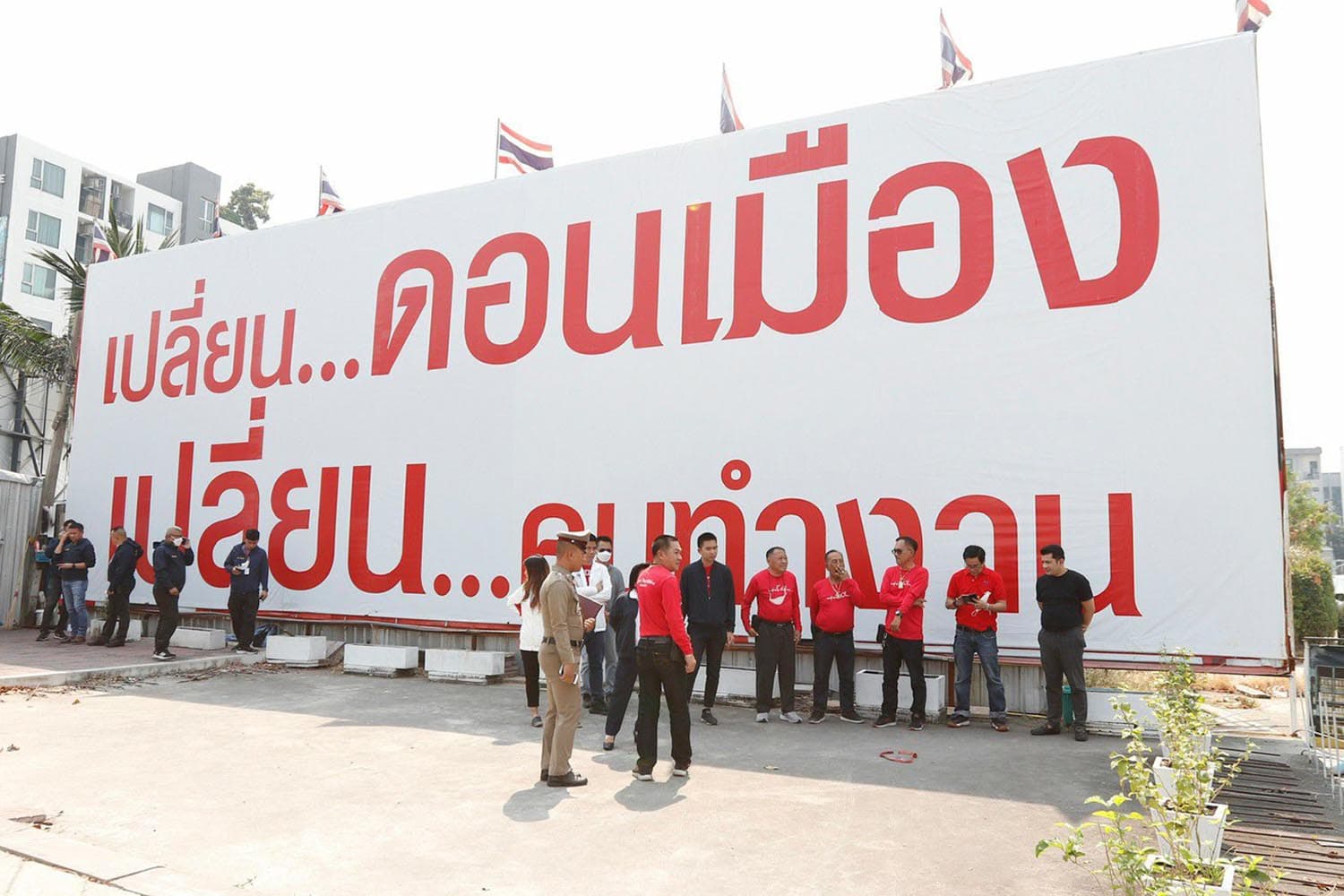 Arrested_man_throwing_ping_pong_bomb_at_Phua_Thai_election_coordination_center_SPACEBAR_Hero_09ae1a4700.jpeg