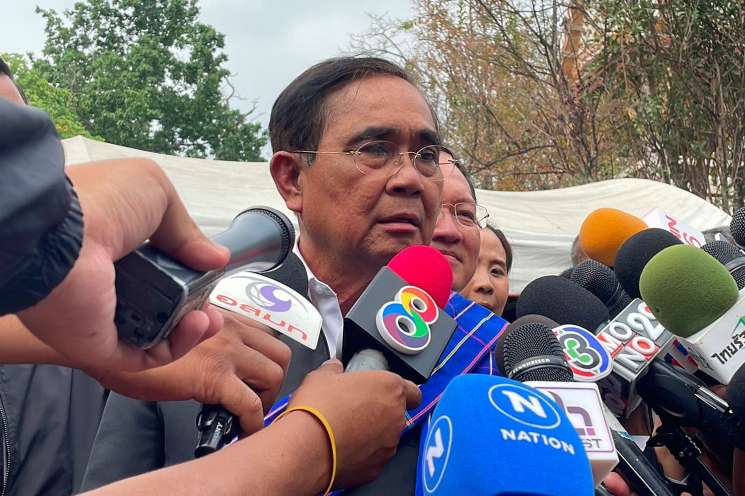 Prayut_prays_for_the_country_to_move_forward_ignoring_3_fingers_messing_with_the_law_SPACEBAR_Hero_d0ed195194.jpeg