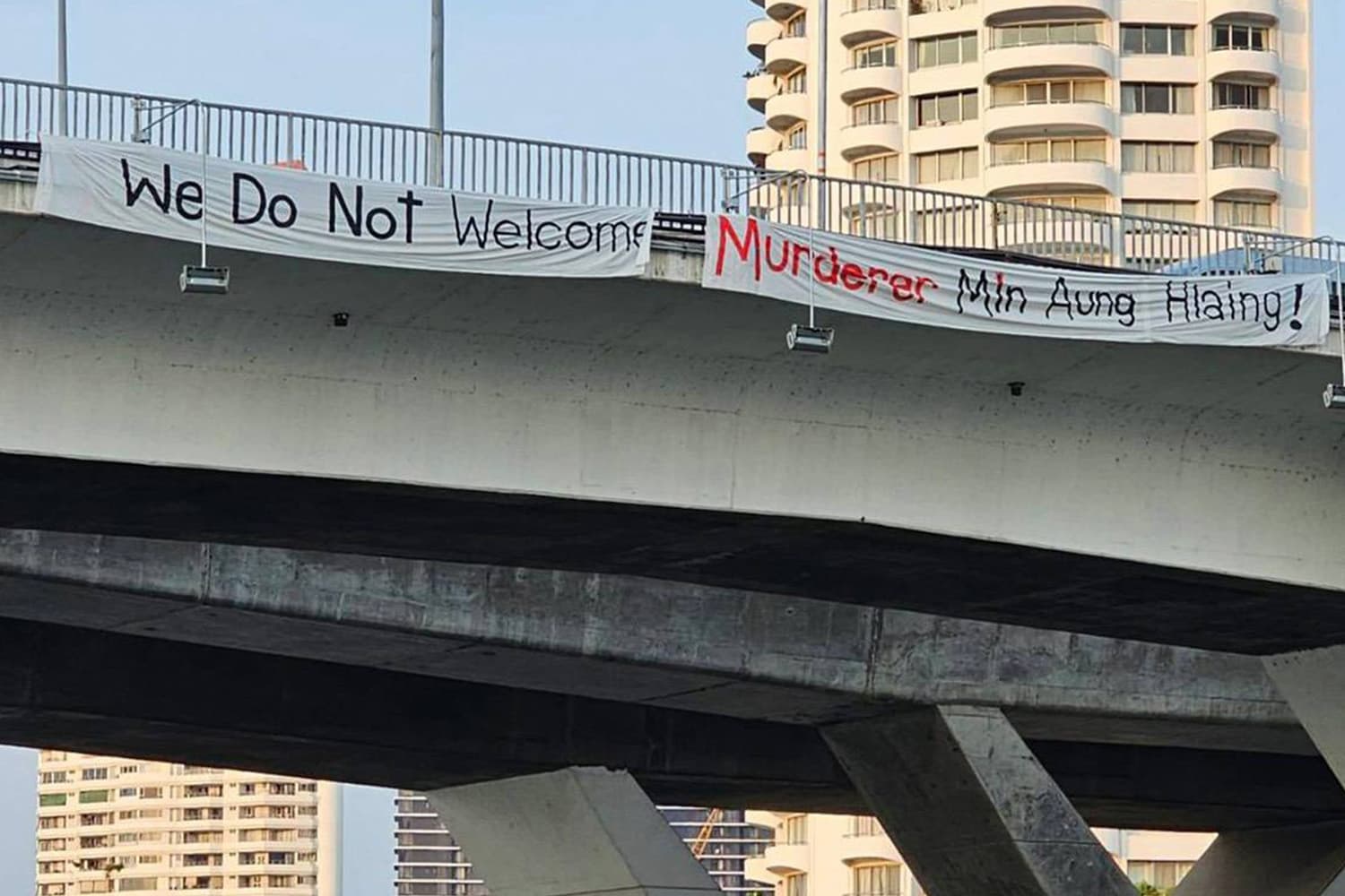 Protest_signs_against_Myanmar_leader_near_BIMSTEC_summit_SPACEBAR_Hero_b4f7c023b6.jpg