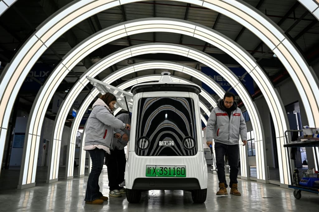 At the Neolix factory, 300 kilometres (186 miles) north of Shanghai, newly built driverless vehicles zoomed around a testing track simulating obstacles including puddles and bridges