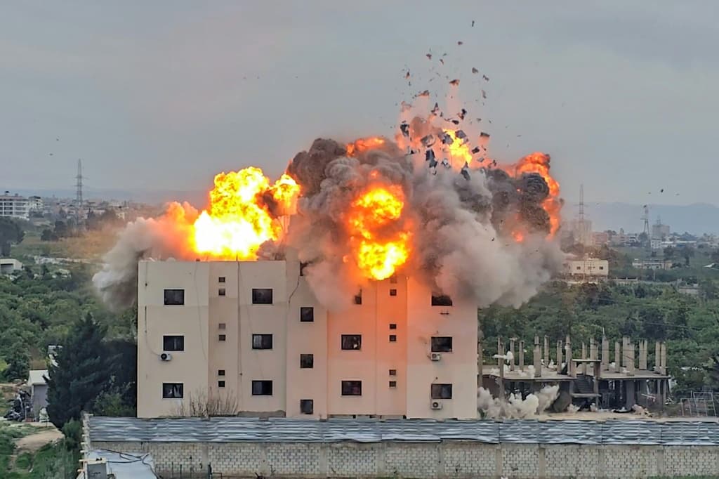 Israel has also been striking Lebanon, here hitting a building in the southern Lebanese village of Abbasiyyeh on Friday