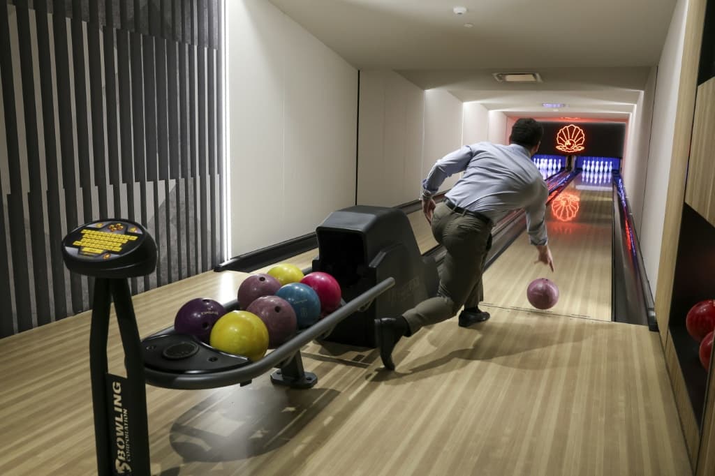 At Pearl House, a 1972 building at 160 Water Street, the conversion has resulted in nearly 600 new apartments with luxury amenities such as a bowling alley and a pet club
