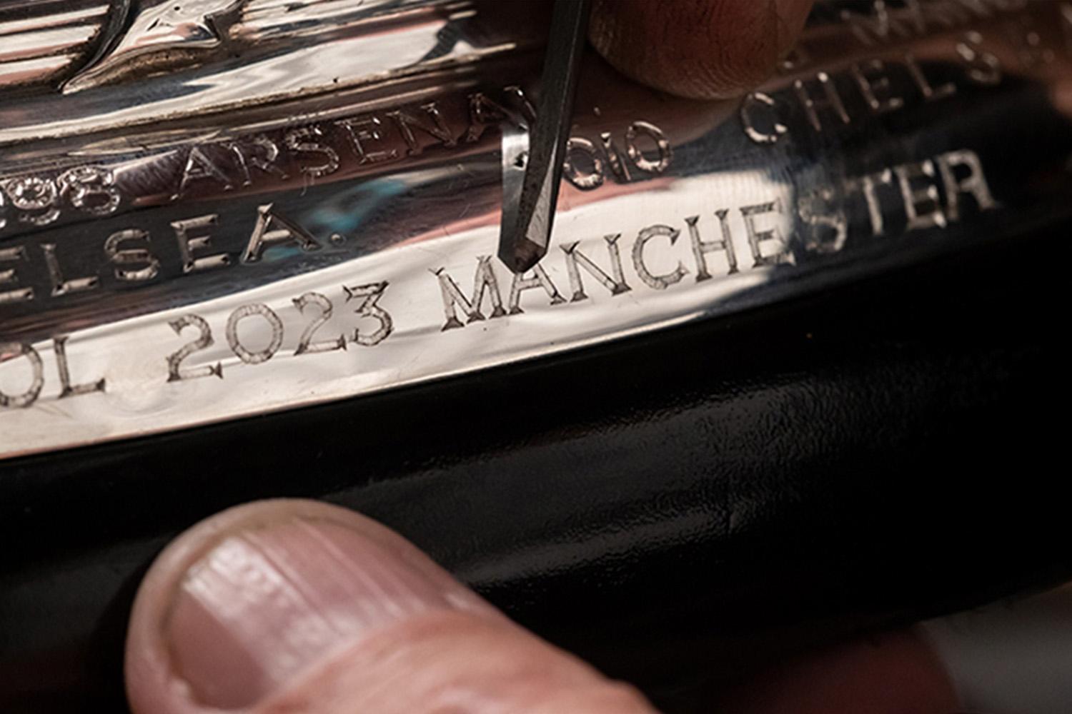 Manchester-engraving-on-trophy-before-the-final-FA-Cup-SPACEBAR-Hero